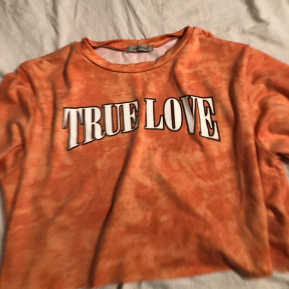 A true love orange shirt in good condition.